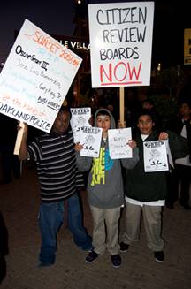 These children, a racial cross-section of Oakland, seem determined to stop the police open season on young men of color before its their turn. The sign on the left reads, Sunset 2008-90 RIP Oscar Grant III, Casper Banjo, Jose Luis Buenrostro, Jody Woodfox, Gary King Jr., Andrew Moppin and others at the hands of Oakland police.  Photo: Demondre Ward