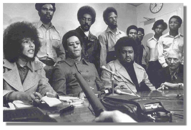 Elaine Brown (bottom left) and to her side Huey P. Newton leading the Black Panthers at a press conference in San Francisco. (October 1971)